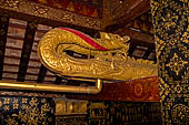 Wat Xieng Thong temple in Luang Prabang, Laos. The wooden pipes in the shape of a naga used during Lao New Year to pour water on a Buddha image. 